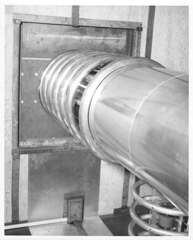 inside lead-lined high voltage enclosure<br>the end plate at rear and the accelerator tube<br> with the ion source in the metal tube<br>and the power supply below it.